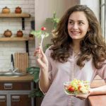 brunette-woman-eating-salad-min