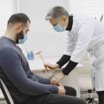 healthcare-medical-concept-doctor-with-patient-hospital-man-neurologist-office-min